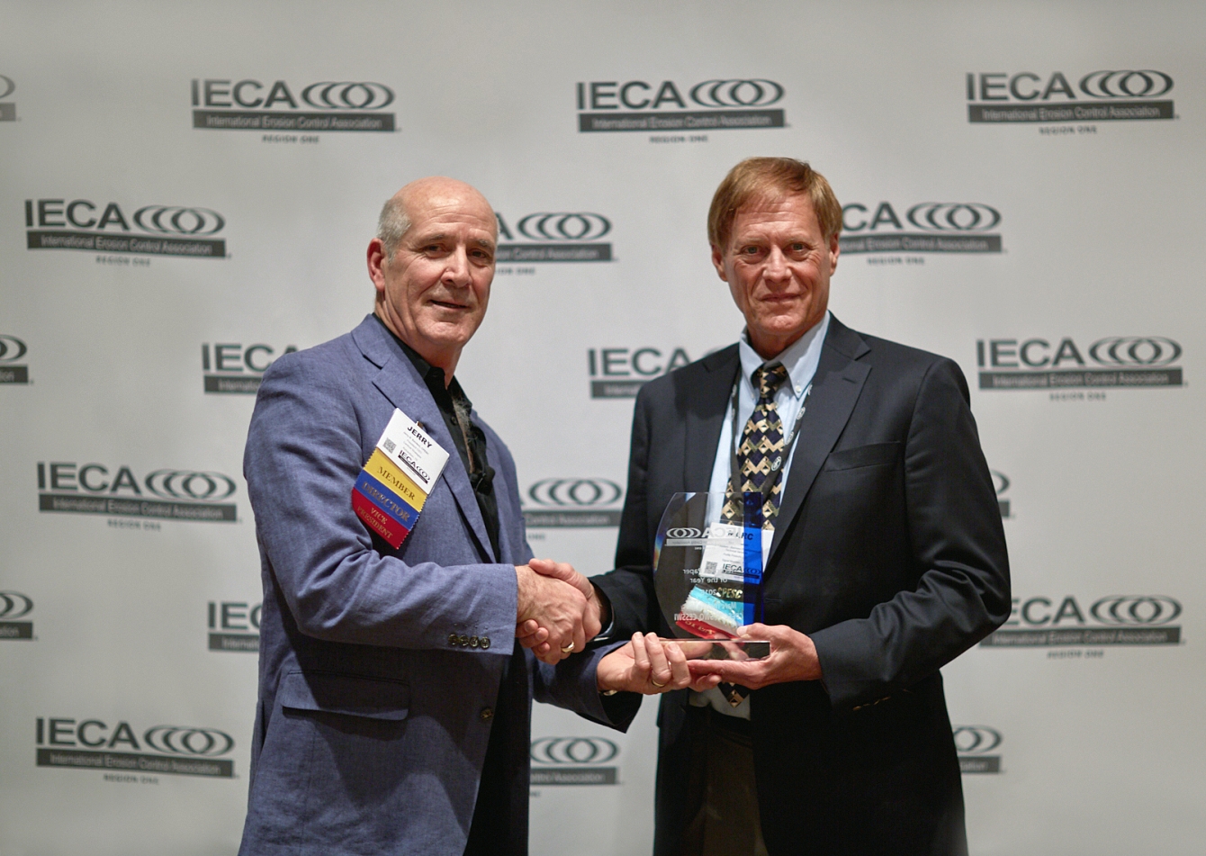 Profile's Marc S. Theisen (right) receiving the 2018 IECA Technical Paper of the Year Award.