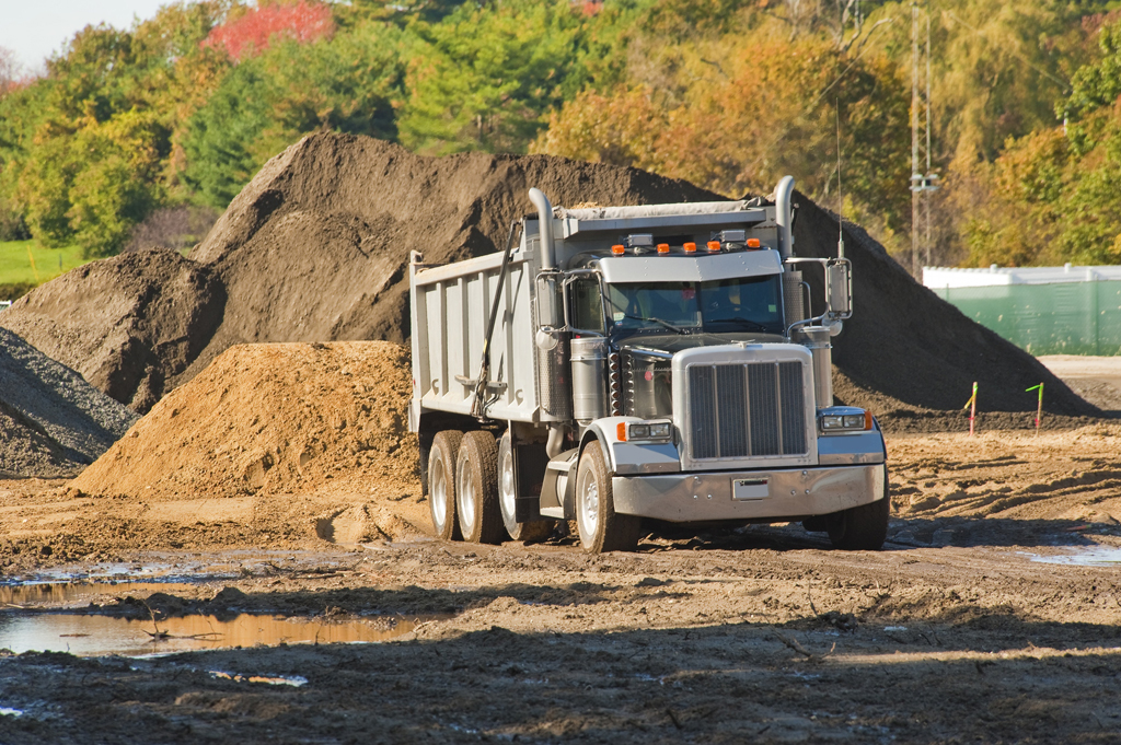 Topsoil stockpiles are typically designed to minimize footprint.