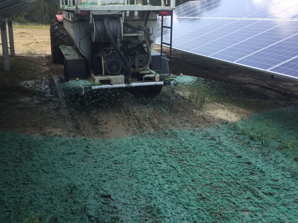 Hydroseeders can easily spread material in difficult to reach areas, including under solar panels.